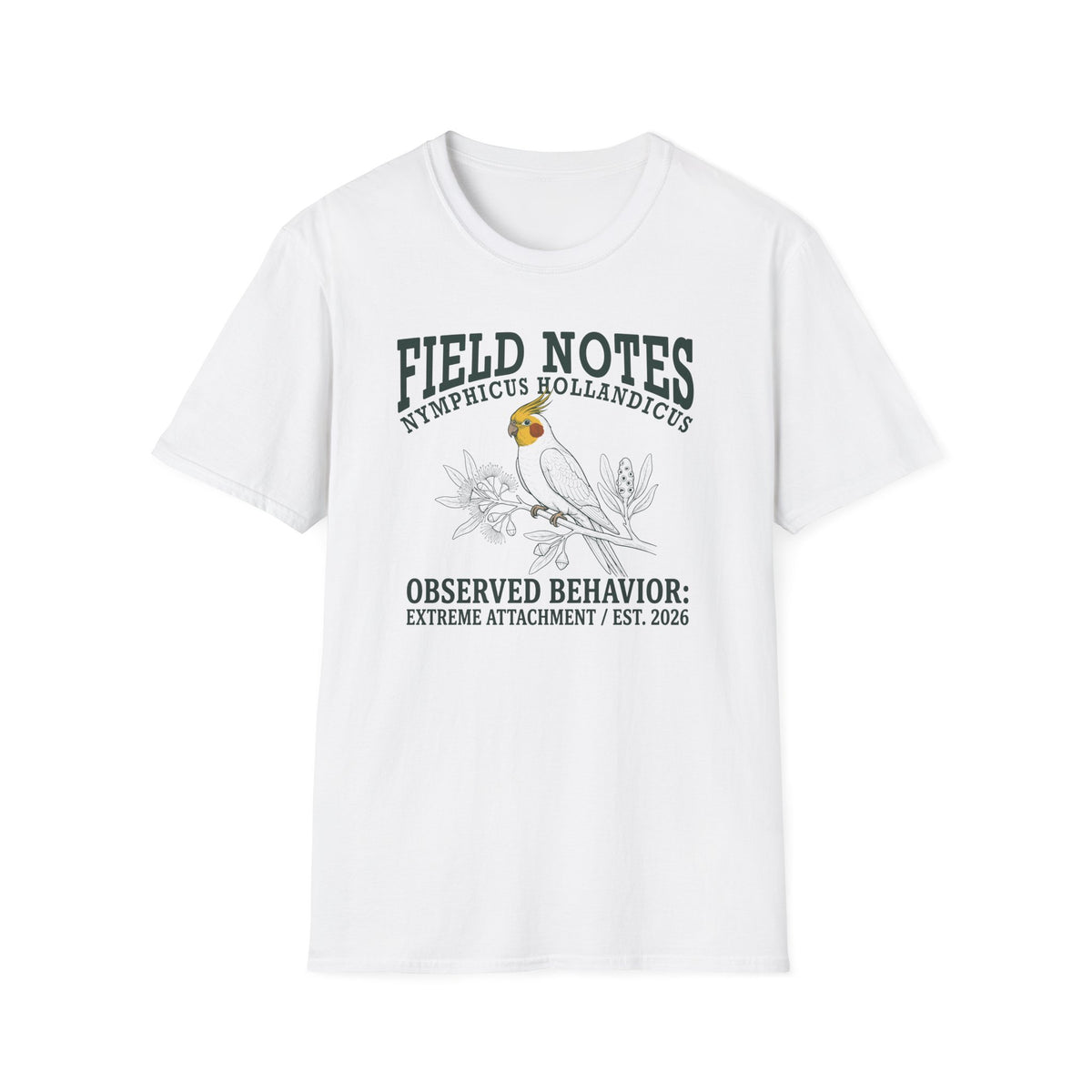 A white short-sleeve crewneck t-shirt featuring a dark green and black graphic print of a cockatel with the text 'FIELD NOTES NEMPLICUS HOLLANDICUS' and 'OBSERVED BEHAVIOR: EXTREME ATTACHMENT / EST. 2026'.